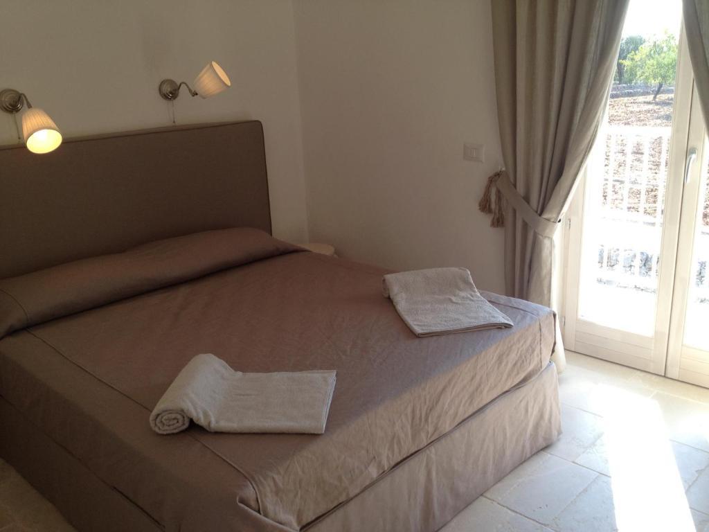 Il Granello Di Senape In Valle D'Itria Guest House โลโกโรตอนโด ห้อง รูปภาพ